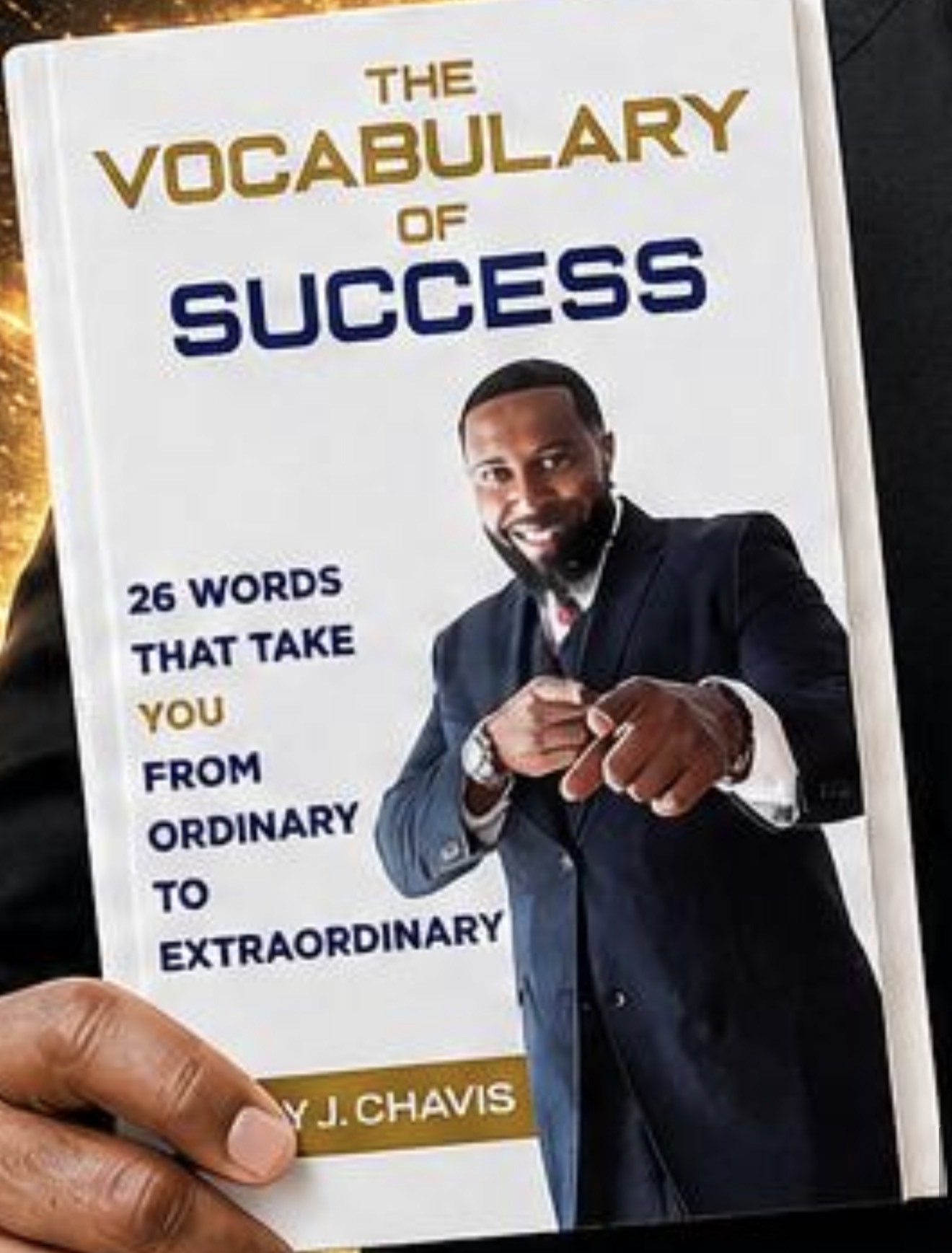 Book cover of The Vocabulary of Success by Cory J. Chavis, showing the author in a professional portrait with warm, confident lighting